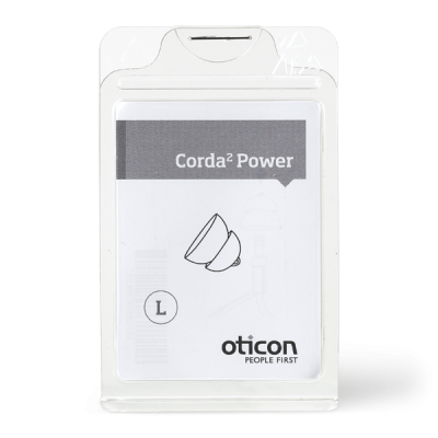 A clear plastic package contains a Corda 2 Power Dome hearing aid accessory, size L. The label shows a product illustration, the Oticon logo, and the text 